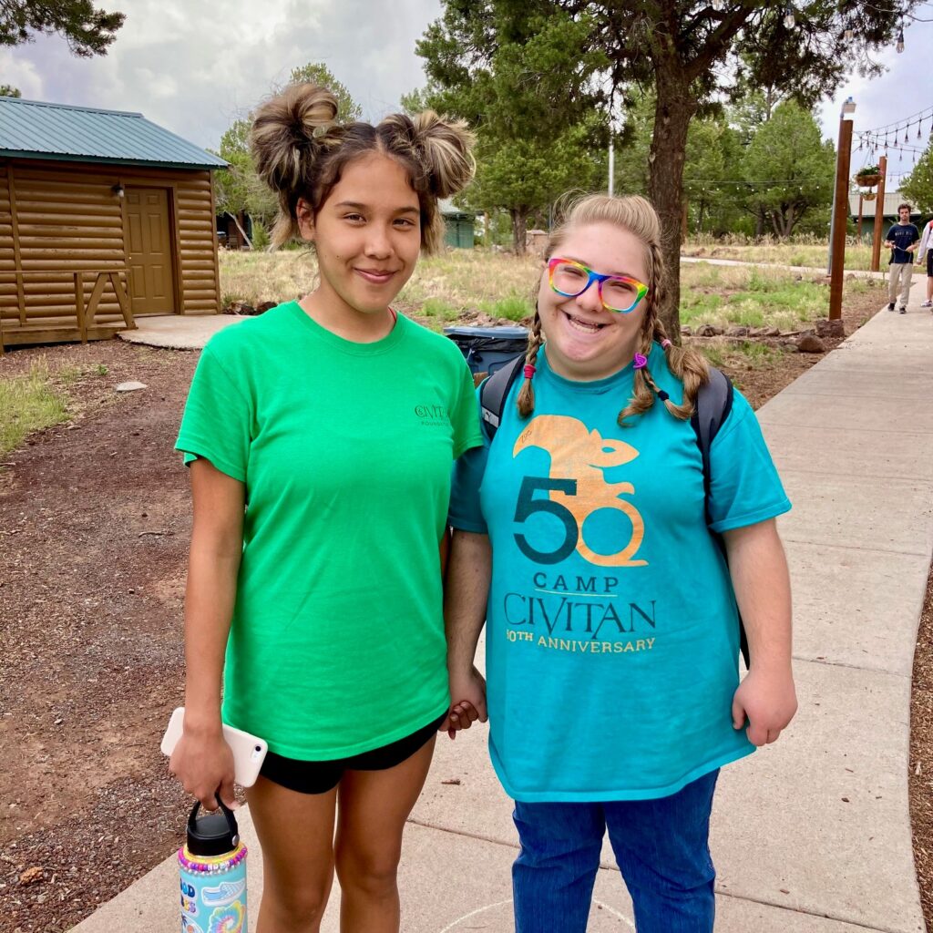 Camp Civitan Volunteer and Camper Pose for Photo 